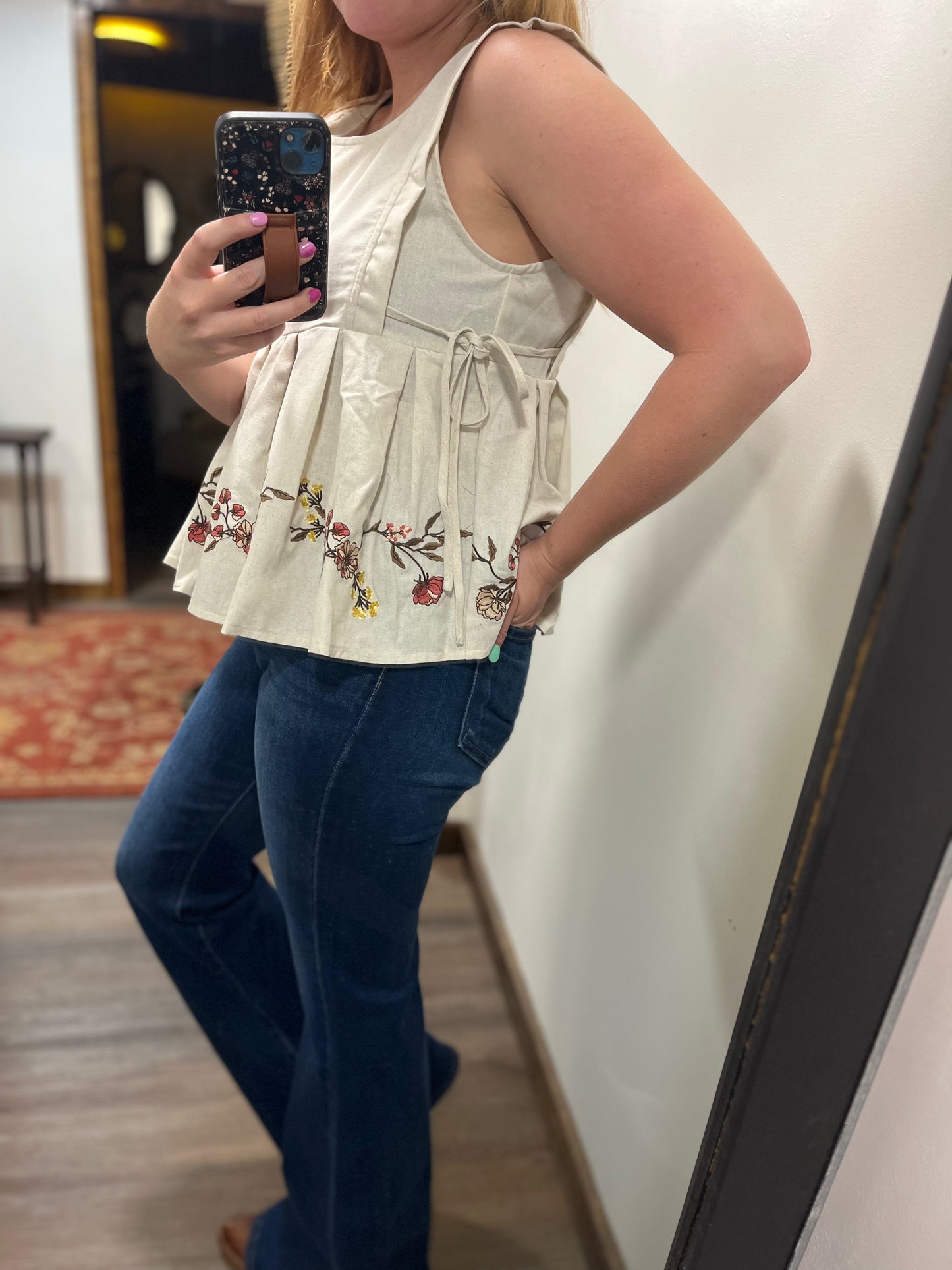 EMBROIDERED SLEEVELESS PLEATED PEPLUM TOP