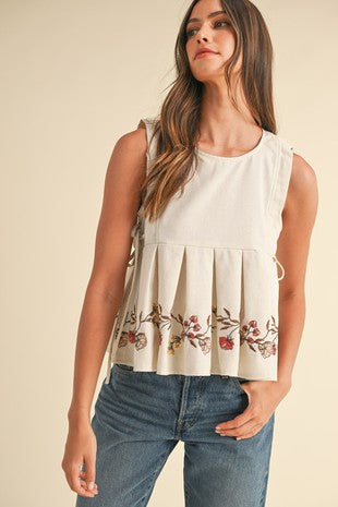 EMBROIDERED SLEEVELESS PLEATED PEPLUM TOP